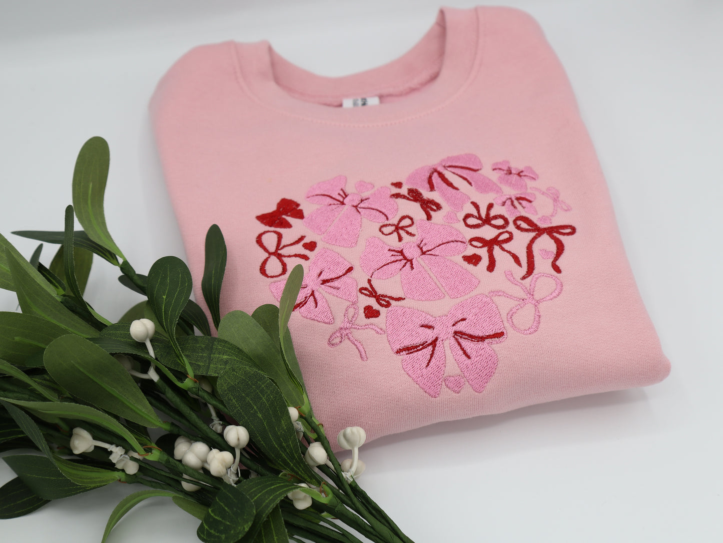 Pink Embroidered sweater with pink and red bows