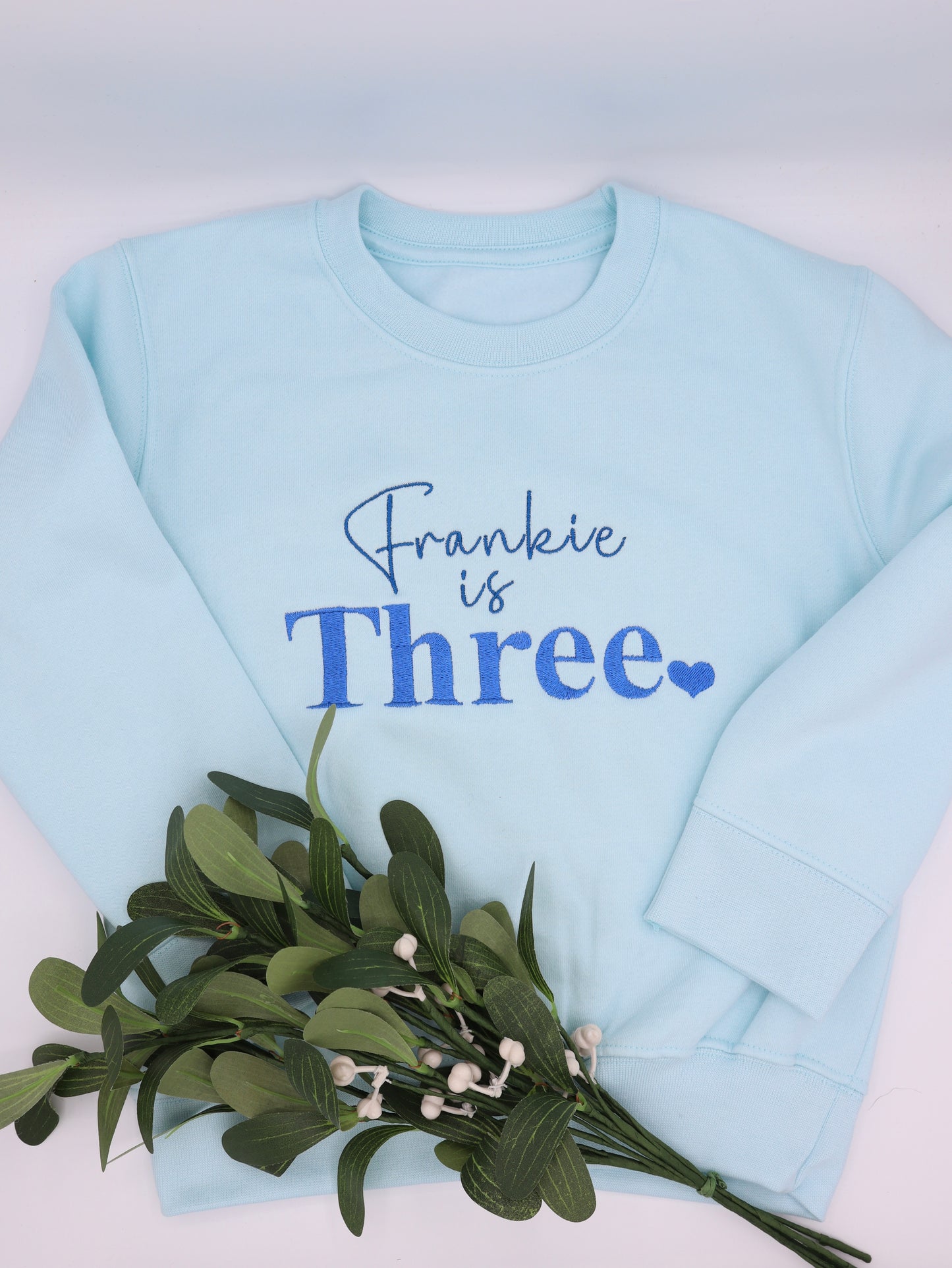 Blue Embroidered sweater with childs name and age and a small heart