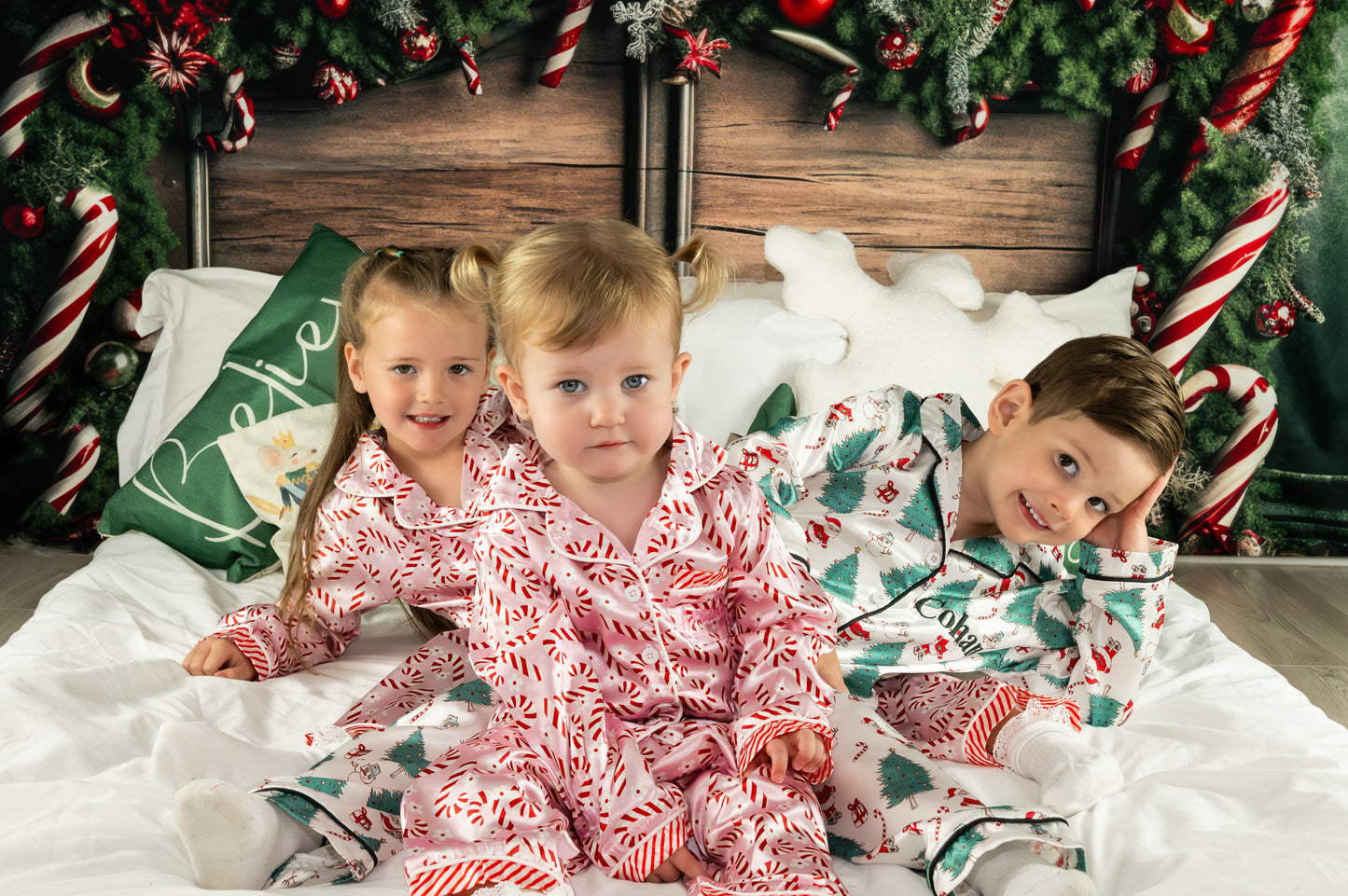 Personalised kids satin pjs with christmas design of santa, christmas tree, snowman and candy canes
