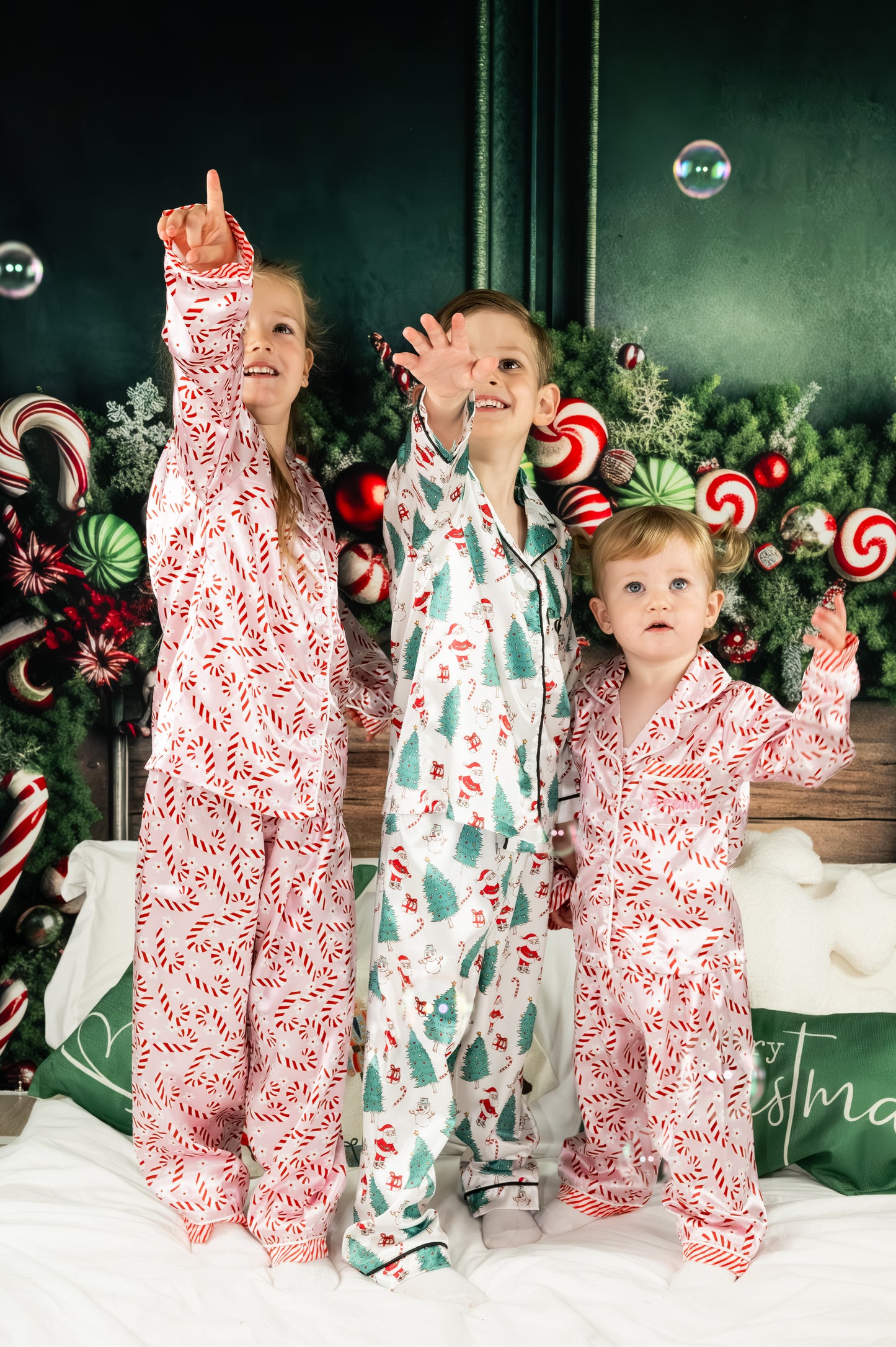 Personalised kids satin pjs with christmas design of santa, christmas tree, snowman and candy canes