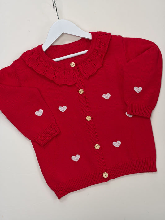 red cardigan with white embroidered love hearts 