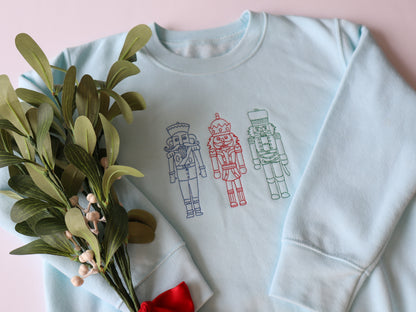 Kids sweater with three embroidered nutcrackers 