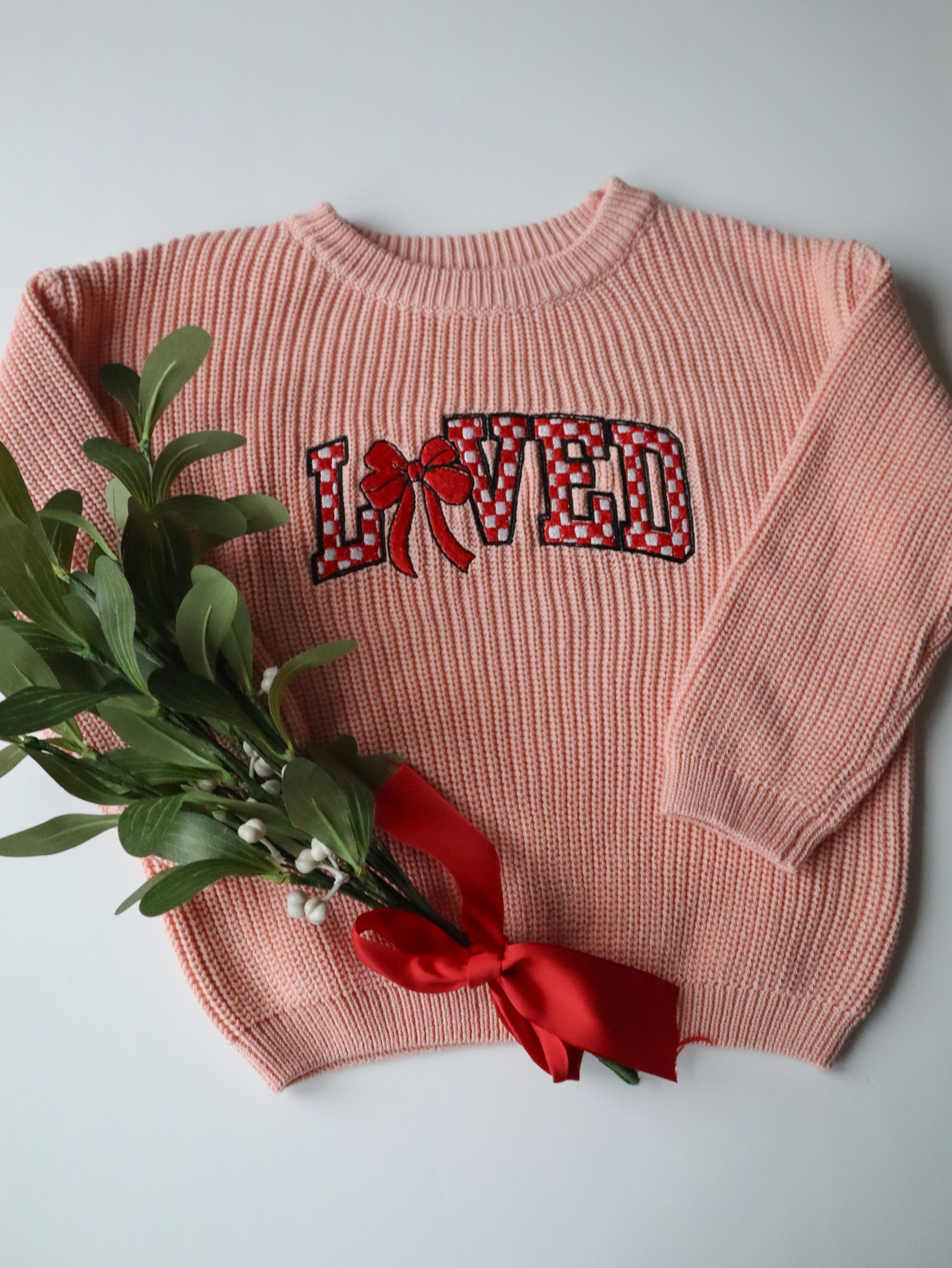 Pink Knitted sweater with embroidered Loved 