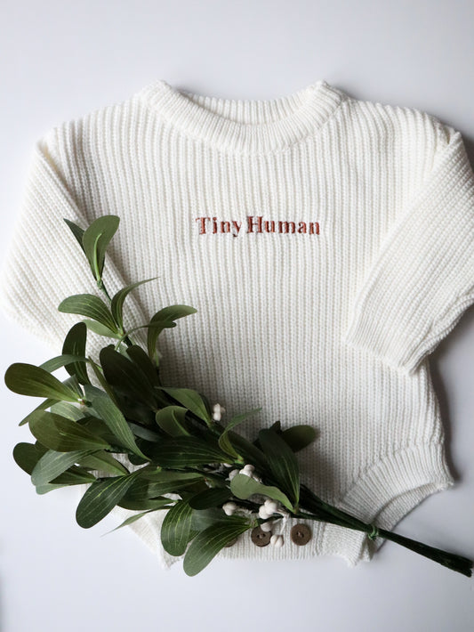 Baby Knitted romper with embroidered slogan Tiny Human