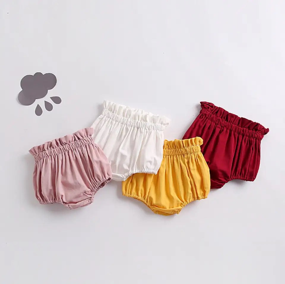 Baby and toddler bloomer pants available in pink, white, yellow and red