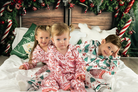 Personalised kids satin pjs with christmas design of santa, christmas tree, snowman and candy canes 