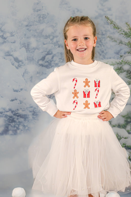 Christmas themed embroidered kids sweater featuring a candy cane, gingerbread man and christmas gift