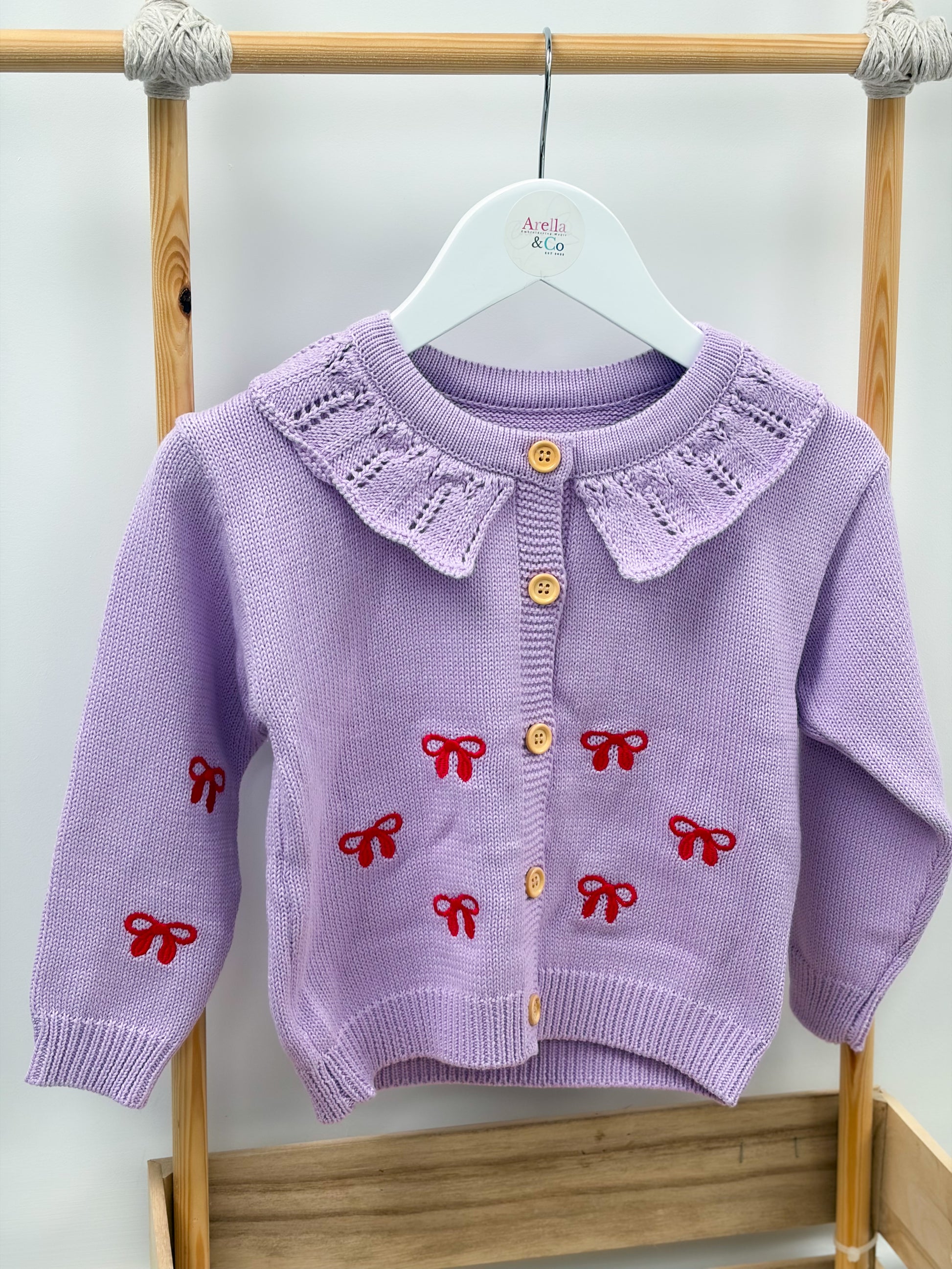 Lilac bow knit cardigan with red embroidered bows