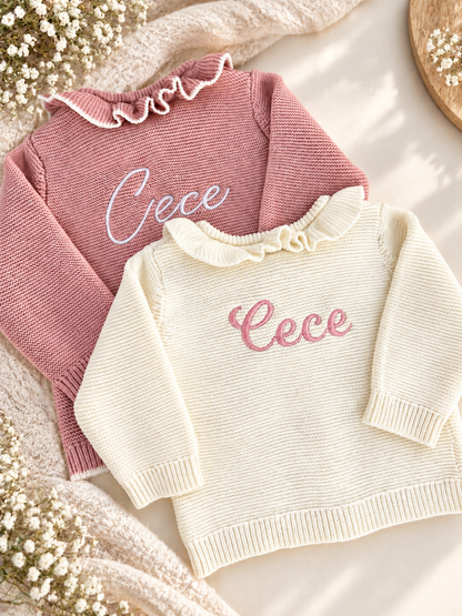Personalised pink and white cardigan with the name Cece embroidered on