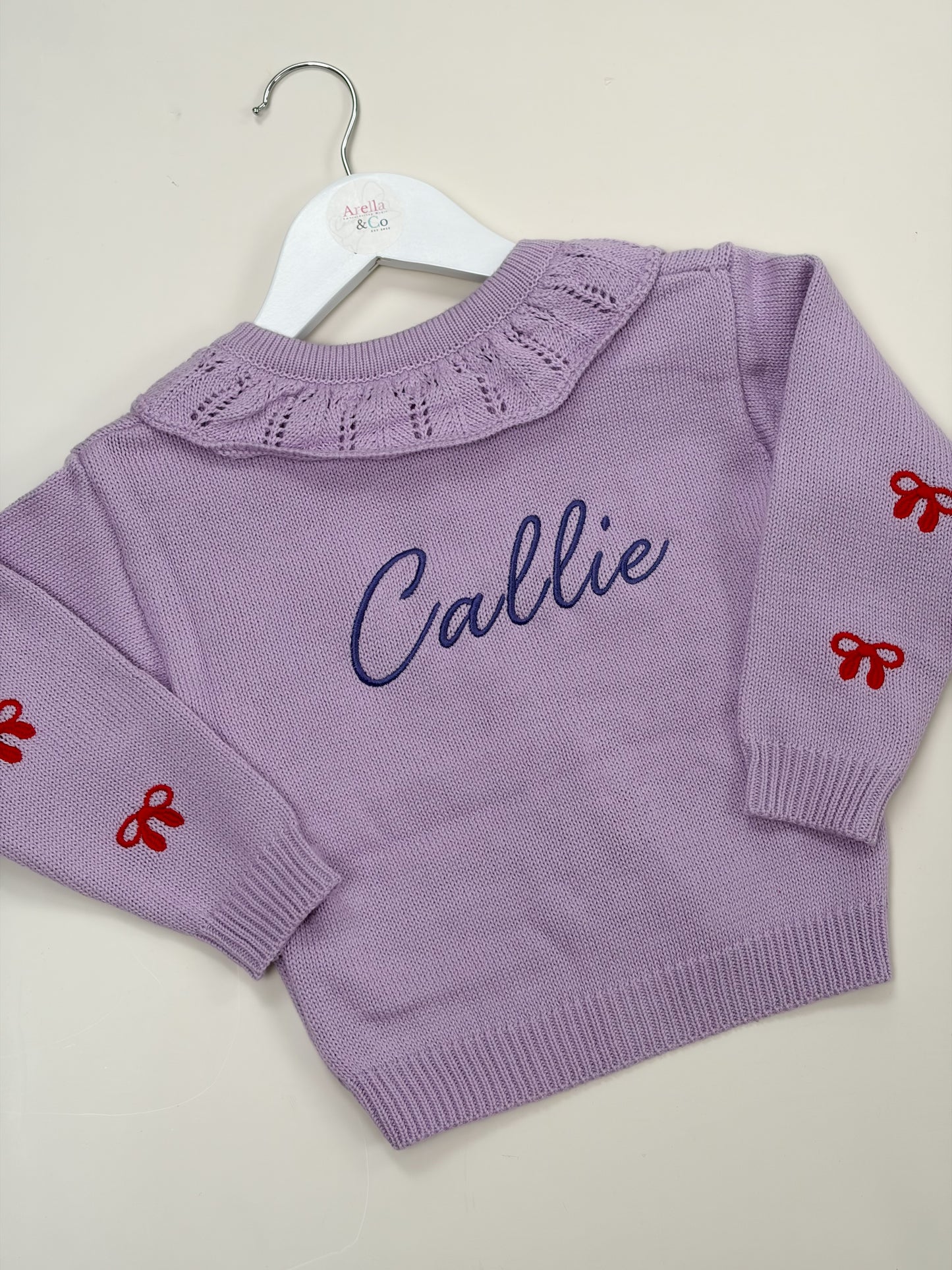 Lilac embroidered cardigan with embroidered name with red bows 