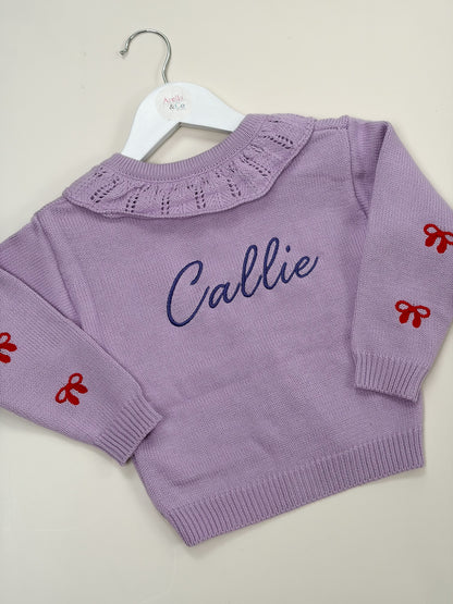 Lilac embroidered cardigan with embroidered name with red bows 