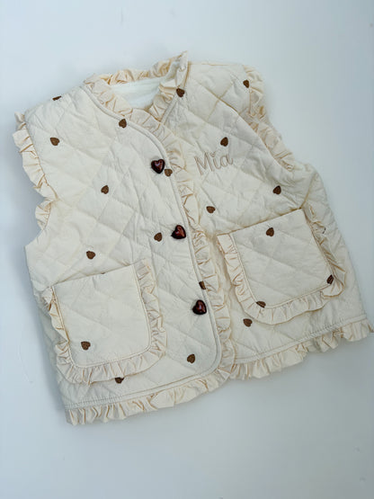 Off White gilet with heart patterns on a light gray background