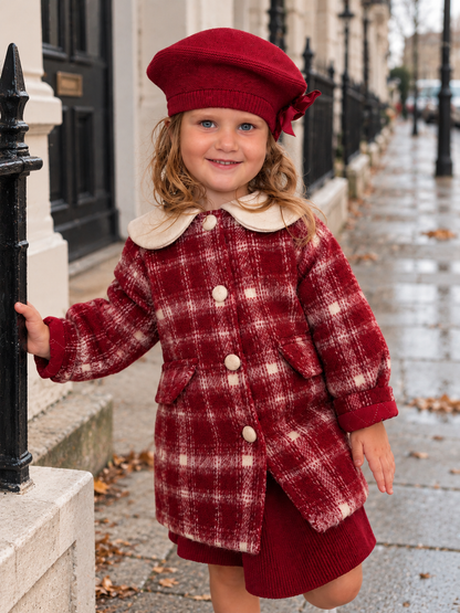 girl wearing a red plaid coat 